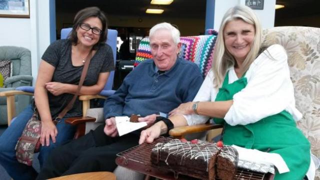 90 year old Robert Hopkins enjoys meeting friendly faces at Hayle Hub free lunch, shown here with Hayle Hub members Jane Haskins (left) and Alison Saunders